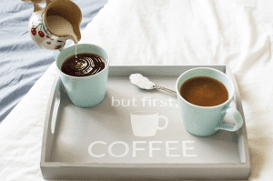 Make mornings more fun with an easy-to-make tray for your daily cup of coffee. Using chalk paint, a silhouette stencil, and an unfinished wooden tray from any craft store!