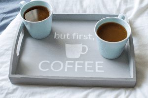 Make mornings more fun with an easy-to-make tray for your daily cup of coffee. Using chalk paint, a silhouette stencil, and an unfinished wooden tray from any craft store!