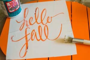 Learn how to easily make a stencil with your Silhouette cutting machine and use it to decorate a Hello Fall wreath to hang on your front door!