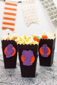 Halloween Popcorn Bags - Hocus Pocus is my favorite Halloween movie and I watch it multiple times every year. These DIY paper popcorn bags cut with my Silhouette machine are the perfect movie-watching treat bag!
