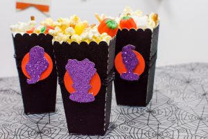 Halloween Popcorn Bags - Hocus Pocus is my favorite Halloween movie and I watch it multiple times every year. These DIY paper popcorn bags cut with my Silhouette machine are the perfect movie-watching treat bag!