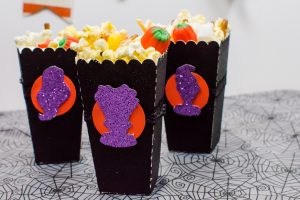 Halloween Popcorn Bags - Hocus Pocus is my favorite Halloween movie and I watch it multiple times every year. These DIY paper popcorn bags cut with my Silhouette machine are the perfect movie-watching treat bag!