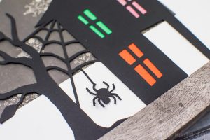 Spooky Halloween Frame - I hate the scary aspect of Halloween so I typically don't decorate for the holiday. But I found the perfect non-scary Silhouette file and paired it with my paper banner to create a fun Halloween decoration that's more cute than spooky!