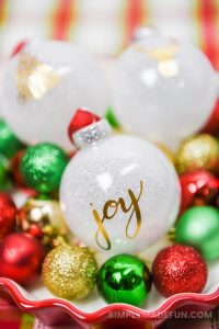 white glitter ornaments with a gold foil design