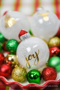 white glitter ornaments with a gold foil design