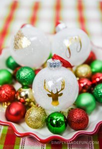 white glitter ornaments with a gold foil design