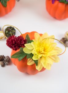 Floral Mickey Ears pumpkin - I hate spending money on pumpkins that mold quickly and make a mess when you carve them. So I'm switching to a simple + cheap version, styrofoam pumpkins from the Dollar Tree, to make my very own Floral Mickey Ears pumpkin!
