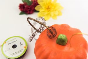 Floral Mickey Ears pumpkin - I hate spending money on pumpkins that mold quickly and make a mess when you carve them. So I'm switching to a simple + cheap version, styrofoam pumpkins from the Dollar Tree, to make my very own Floral Mickey Ears pumpkin!