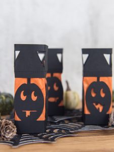 Paper Pumpkin Lanterns - I love lanterns but I hate spending money on them at the store so I decided to make my own mini Halloween paper lanterns instead. They're an easy DIY, cheap, and family friendly. And can be made with a Silhouette or Cricut machine!
