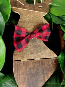 Make the easiest holiday wreath to last through Christmas and beyond! All it takes is a little bit of greenery, wood, and the perfect buffalo plaid ribbon to give your front door a little holiday style.