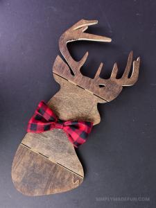 Make the easiest holiday wreath to last through Christmas and beyond! All it takes is a little bit of greenery, wood, and the perfect buffalo plaid ribbon to give your front door a little holiday style.