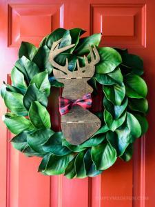 Make the easiest holiday wreath to last through Christmas and beyond! All it takes is a little bit of greenery, wood, and the perfect buffalo plaid ribbon to give your front door a little holiday style.