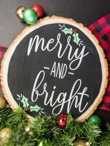 Merry and Bright Christmas Sign - I love saving room and money on Christmas decorations and reversible signs are the perfect way to do both! Using your cutting machine you can repurpose old holiday decor with a new rustic and minimalist design! Free SVG + PNG + DXF file included so you can make one too.