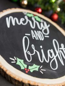 Merry and Bright Christmas Sign - I love saving room and money on Christmas decorations and reversible signs are the perfect way to do both! Using your cutting machine you can repurpose old holiday decor with a new rustic and minimalist design! Free SVG + PNG + DXF file included so you can make one too.