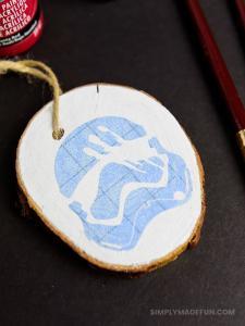 Star Wars Ornaments - Make your own rustic Star Wars Ornaments with wood slices, DecoArt paint, and your Silhouette machine! This simple + quick DIY is perfect for the Star Wars fans in your life!
