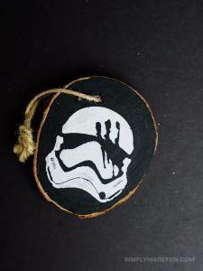 Star Wars Ornaments - Make your own rustic Star Wars Ornaments with wood slices, DecoArt paint, and your Silhouette machine! This simple + quick DIY is perfect for the Star Wars fans in your life!