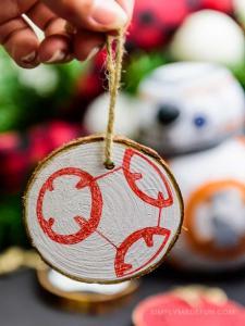 Star Wars Ornaments - Make your own rustic Star Wars Ornaments with wood slices, DecoArt paint, and your Silhouette machine! This simple + quick DIY is perfect for the Star Wars fans in your life!