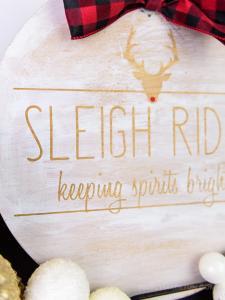 Rae Dunn Inspired Wooden Holiday Sign - After the Christmas decor comes down the whole house feels empty. Make some wall art that'll last all winter long with your Silhouette Machine and some stencil vinyl. This Rae Dunn holiday sign is the perfect rustic DIY for your home!