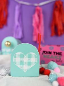Valentine's Day Mailboxes - I am slightly addicted to the Target Dollar Spot when it comes to finding things to craft with. These cute mailboxes I found are perfect to personalize with vinyl and washi tape and give your kids a fun box to put their classmates Valentine's in!