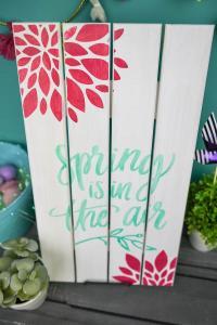 Painted Wooden Spring Sign - Dress up your front porch or your mantle this spring with a bright and colorful wooden sign! Use your Silhouette Cameo to cut out a stencil and pick your favorite paint colors to make this sign your own. It's fun, easy, and you can do it in 20 minutes (or less!).