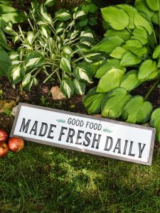 Modern Farmhouse Kitchen Sign - Use your Silhouette Cameo to add a little Farmhouse charm to your kitchen with the FREE farmhouse inspired SVG + PNG file! All it takes is 8 supplies (or less!) to make a one of a kind sign to hang up in your home.