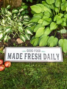 Modern Farmhouse Kitchen Sign - Use your Silhouette Cameo to add a little Farmhouse charm to your kitchen with the FREE farmhouse inspired SVG + PNG file! All it takes is 8 supplies (or less!) to make a one of a kind sign to hang up in your home.
