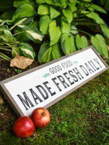 Modern Farmhouse Kitchen Sign - Use your Silhouette Cameo to add a little Farmhouse charm to your kitchen with the FREE farmhouse inspired SVG + PNG file! All it takes is 8 supplies (or less!) to make a one of a kind sign to hang up in your home.