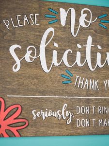 No Soliciting Sign - Who else gets tired of people ringing your doorbell just so they can sell you something? It happens so frequently here and I just wanted it to stop! So I pulled out my Silhouette Cameo and made this no soliciting sign with stencil vinyl and colorful paint in just five easy steps!