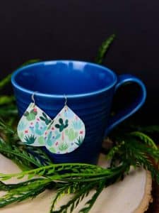 Printed Heat Transfer Vinyl Earrings - It's official, you can use Heat Transfer Vinyl on anything! If you love faux leather earrings because they're lightweight and easy to DIY but are tired of them being plain, you can easily dress them up with heat transfer vinyl and an iron! They take less than 20 minutes to make and the pattern choices are endless.