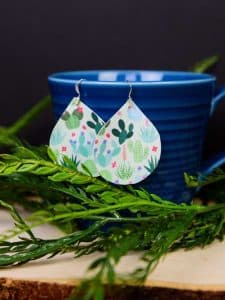 Printed Heat Transfer Vinyl Earrings - It's official, you can use Heat Transfer Vinyl on anything! If you love faux leather earrings because they're lightweight and easy to DIY but are tired of them being plain, you can easily dress them up with heat transfer vinyl and an iron! They take less than 20 minutes to make and the pattern choices are endless.