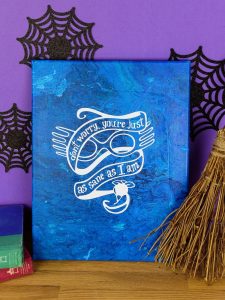 Harry Potter Acrylic Paint Poured Canvas - This poured canvas is the perfect craft night project to DIY with friends! It's fun, messy, and no two canvases will be alike! You can leave them blank or use vinyl and your Silhouette or Cricut machine to dress them up a bit, like with a fun Harry Potter inspired quote or image...or really anything that you like. This craft project is colorful and easy, all you do is mix paint with water and pour!