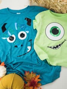 Mike Wazowski and Sully from Monsters Inc family Halloween costumes made with heat transfer vinyl and a Silhouette machine