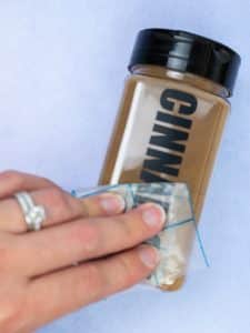 taking transfer tape off adhesive vinyl to make spice jar labels