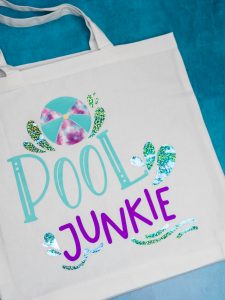 Pool Junkie svg cut file on a beach tote bag